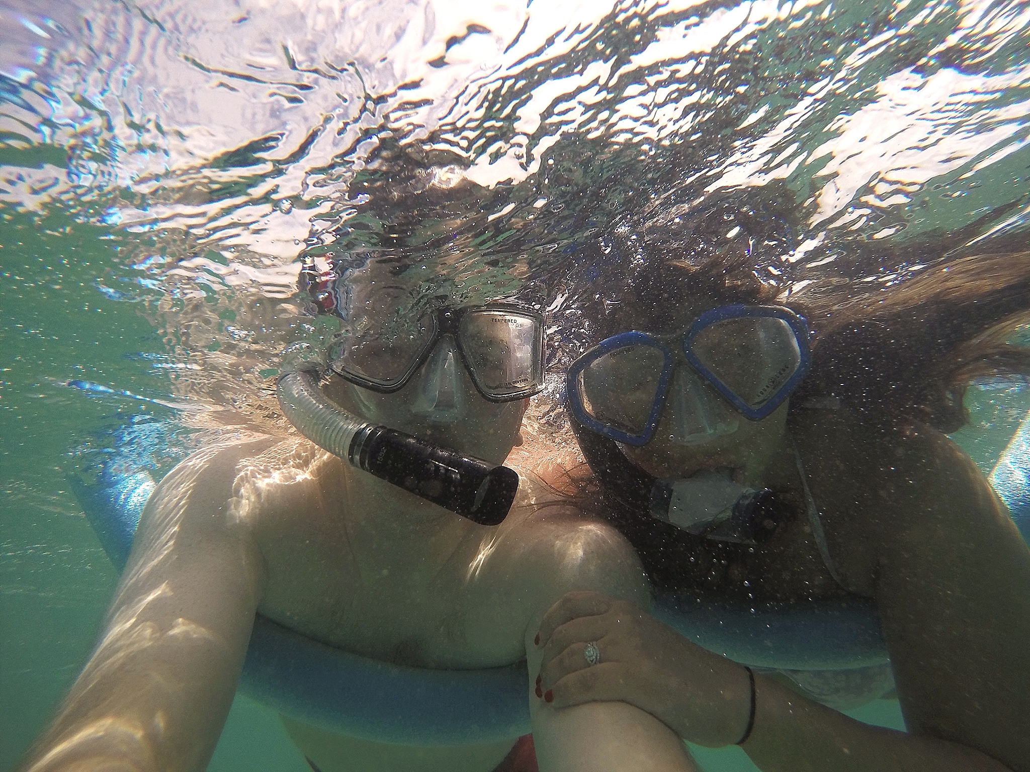 John and Brittney Naylor with goggles and snorkel on underwater in Maui Hawaii