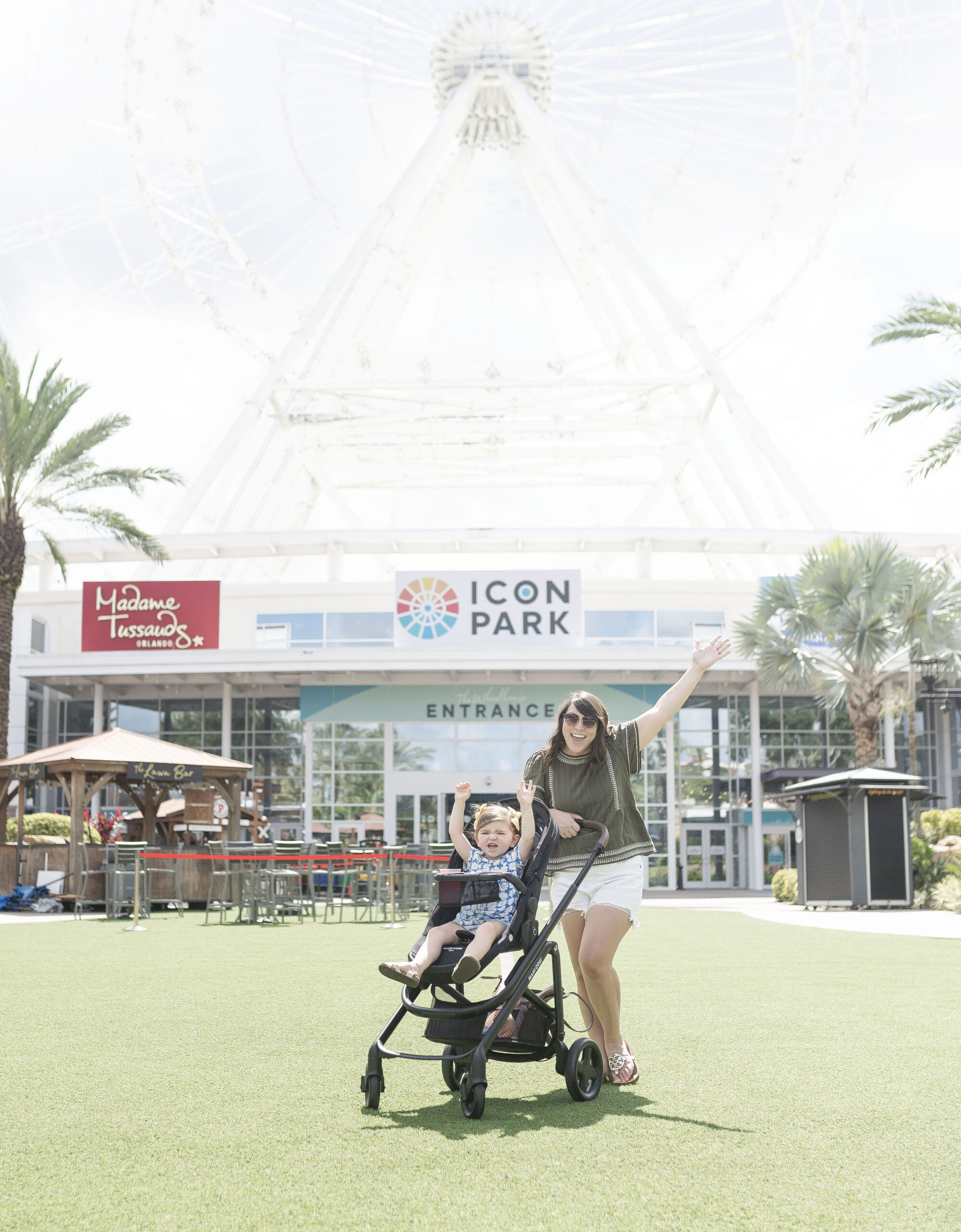 ICON Park Orlando, Brittney Naylor and daughter posing in front of the Orlando Eye, The Wheel