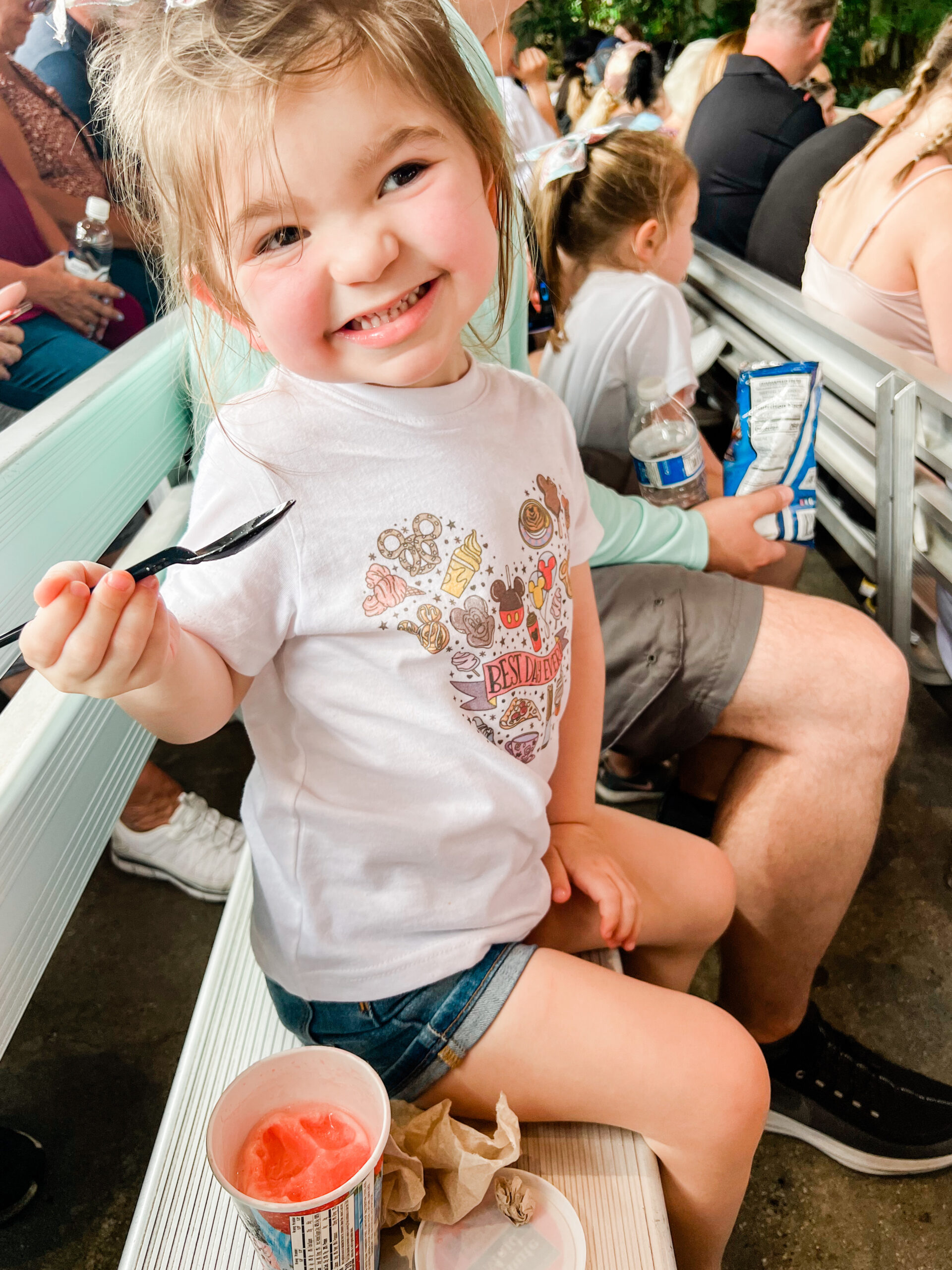 little girl eating ice cream at hollywood studios wearing mickey shirt