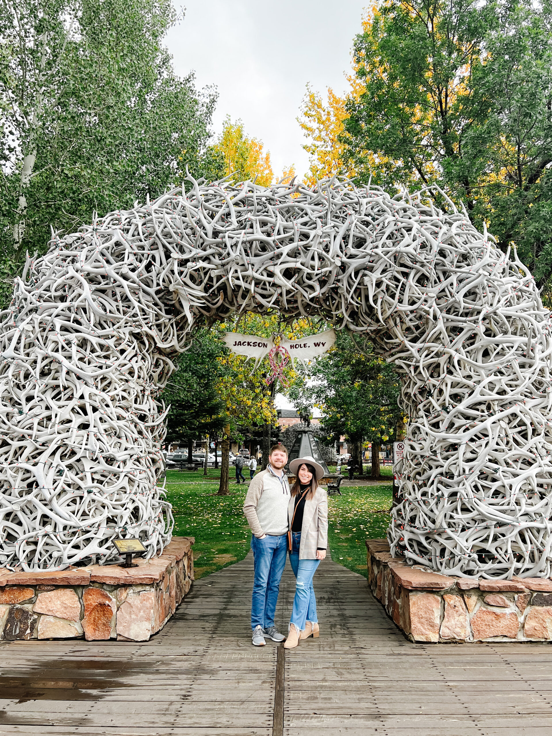 Jackson Square Elk Antler Arch, John and Brittney Naylor standing together underneath, Jackson Hole in September