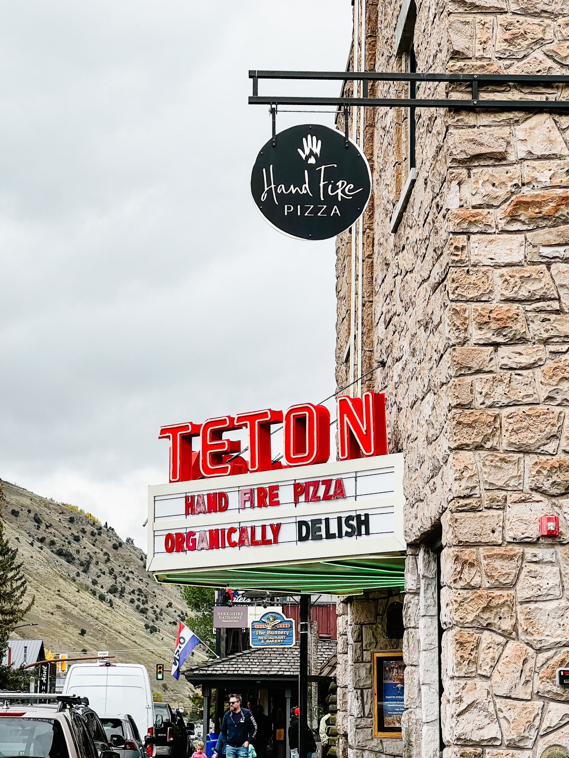 teton in red letters and marquee, hand fire pizza