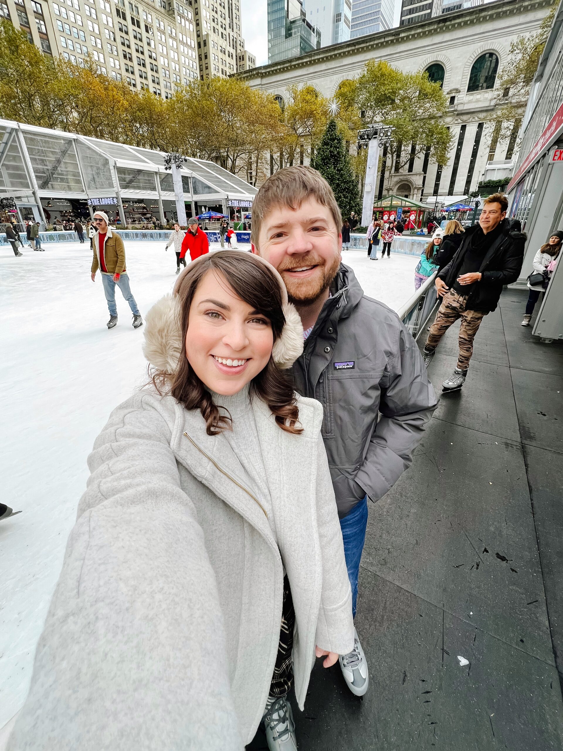 Brittney Naylor and husband at Bryant Park ice skating rink in New York City. NYC Christmastime bucket list Things to do 