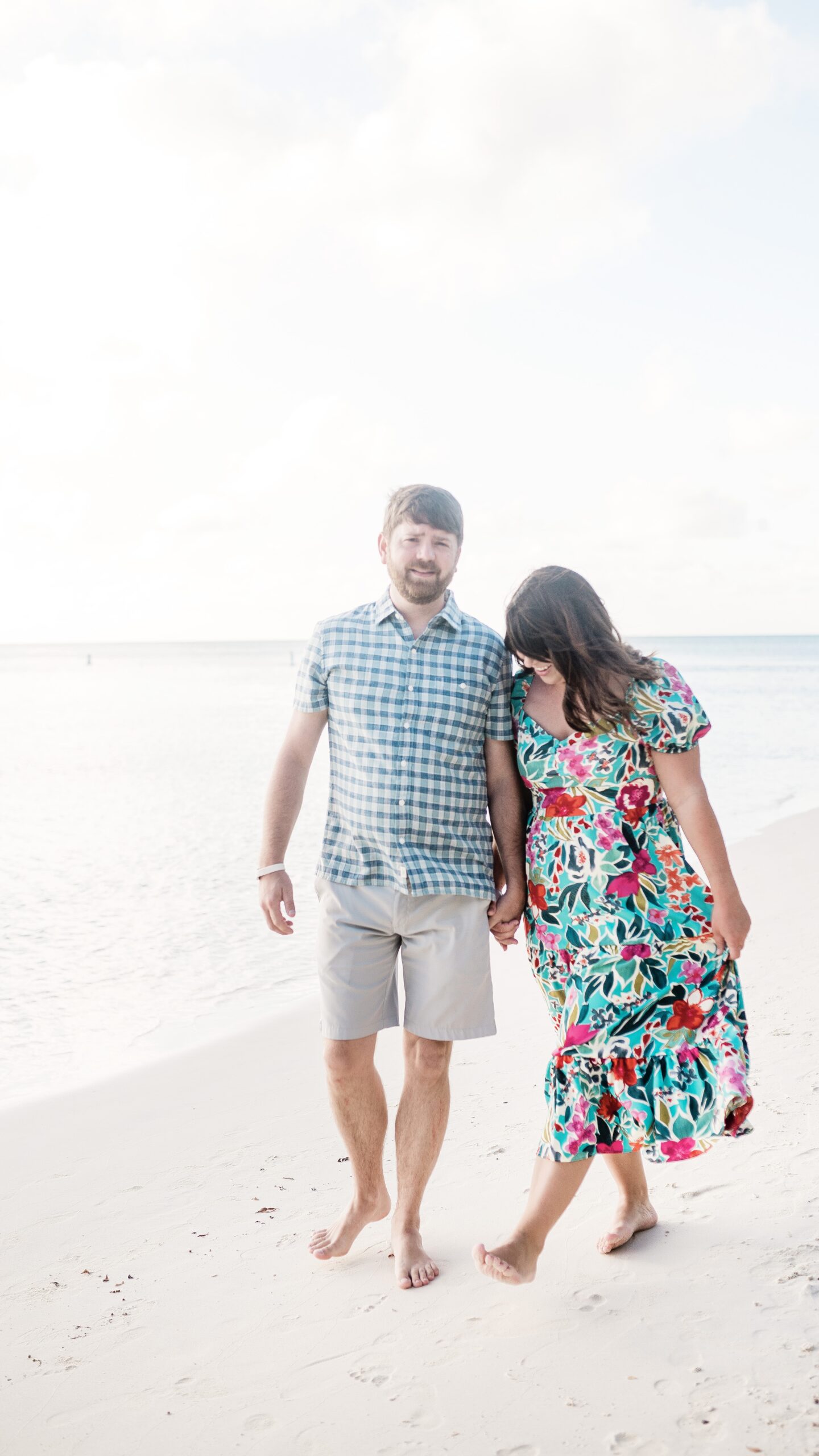 couple walking on the beach in aruba 