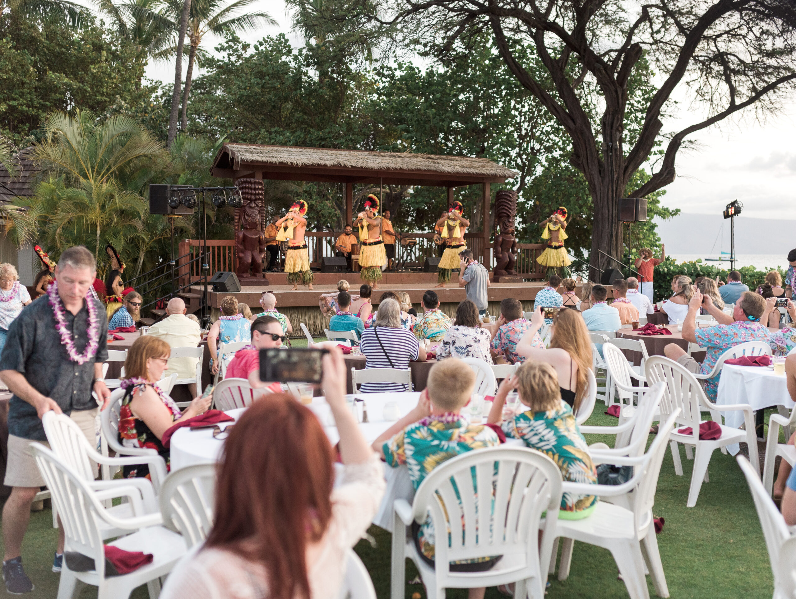 Hawiian dancers on stage at Luau in Maui Hawaii