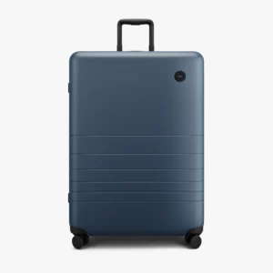 Check In Luggage from Monos Travel, hard shell navy blue suitcase