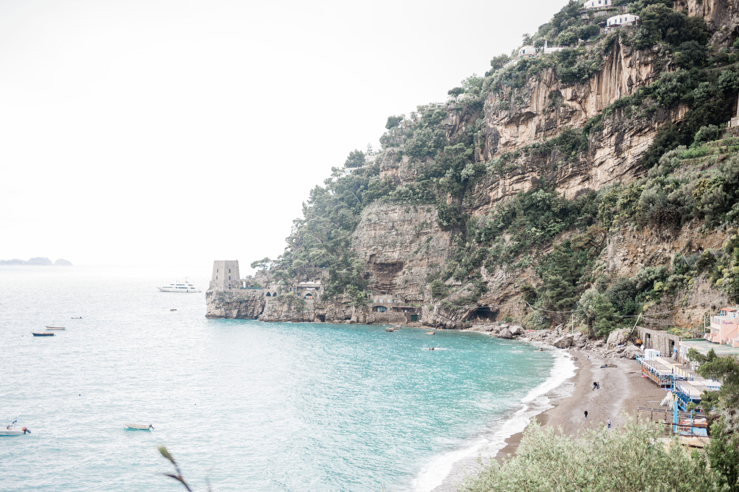 View from Lo Guarracino featuring crystal blue waters and hillside in positano, italy