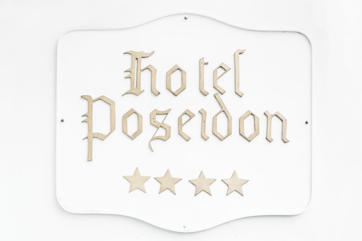 Hotel Poseidon in gold letters at entrance of hotel in Positano Italy