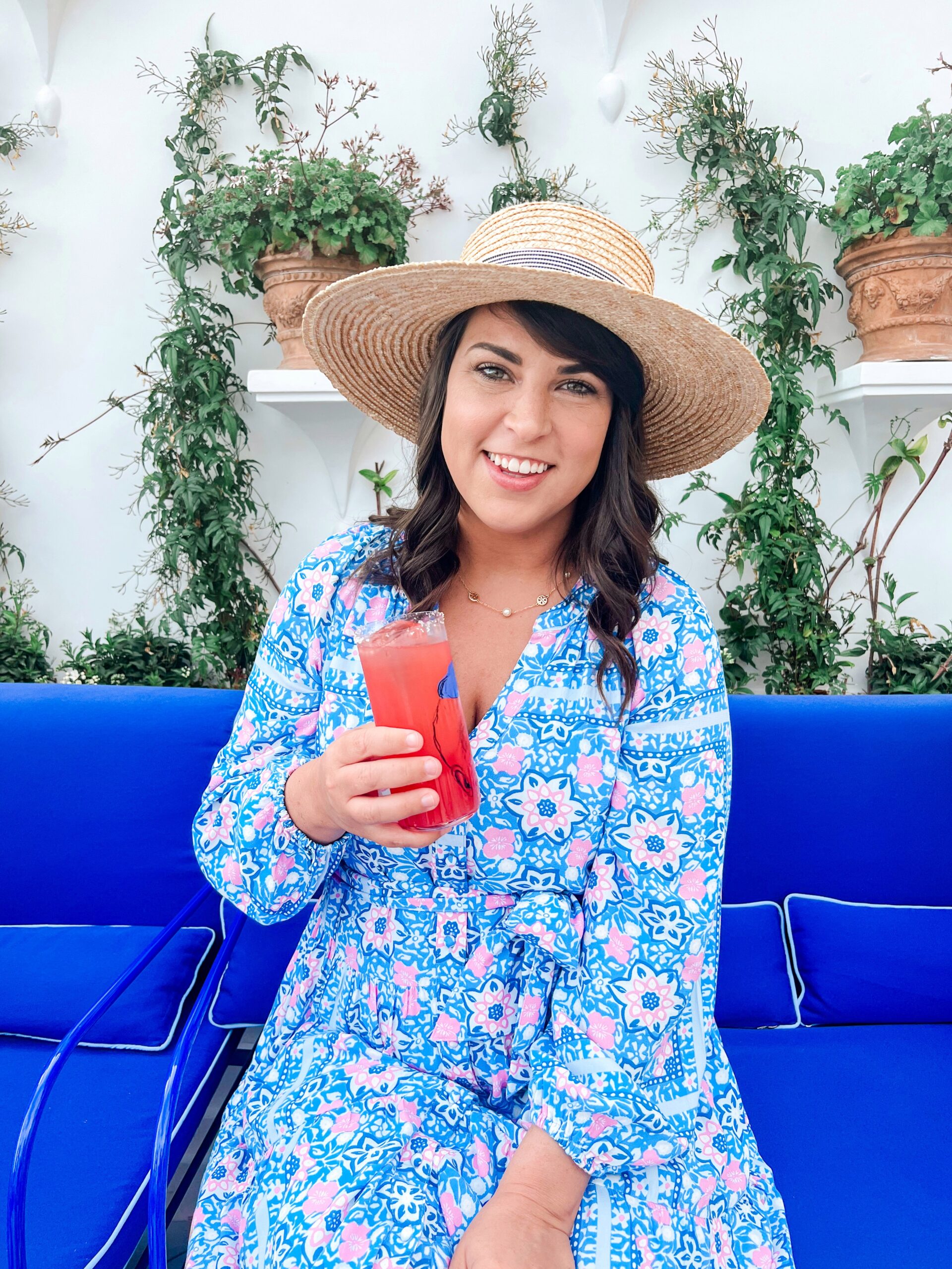 Brittney Naylor holding a drink at Franco's Bar in Positano