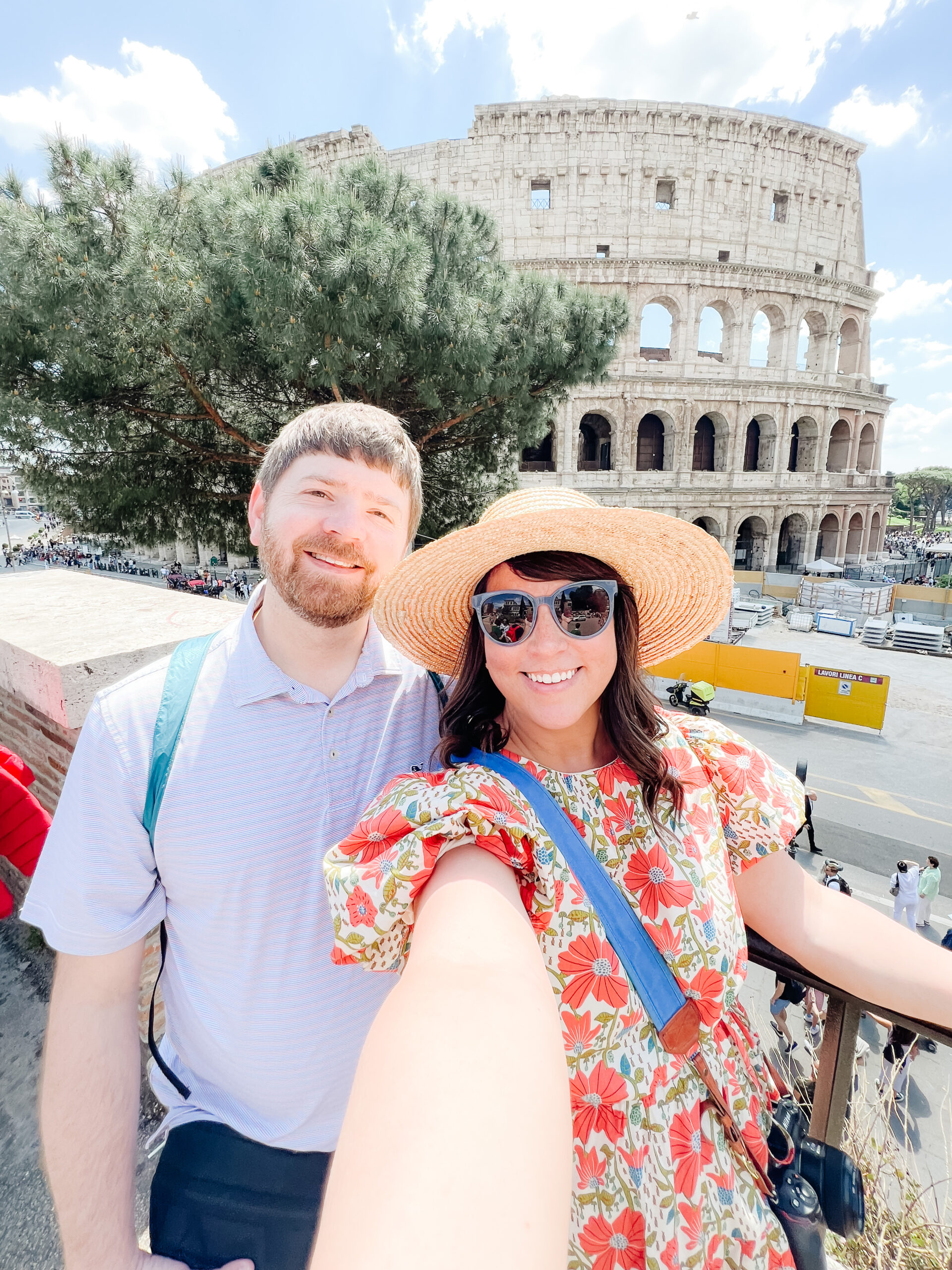 John and Brittney Naylor taking a selfie in front of one of the seven wonders of the world, the colosseum in Rome, Italy. 36 hours in Rome, tips & tricks for traveling to Italy as first timers