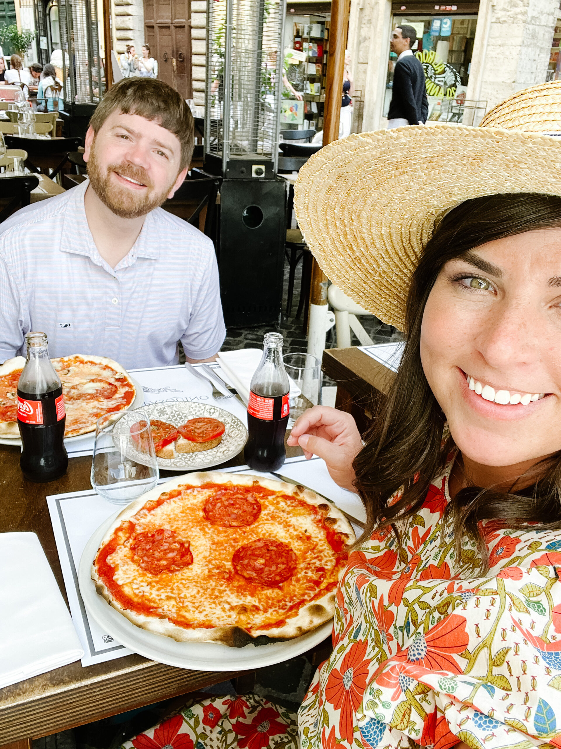 John and Brittney Naylor taking a selfie in Rome with their pizza after their pizza making class, 36 hours in Rome