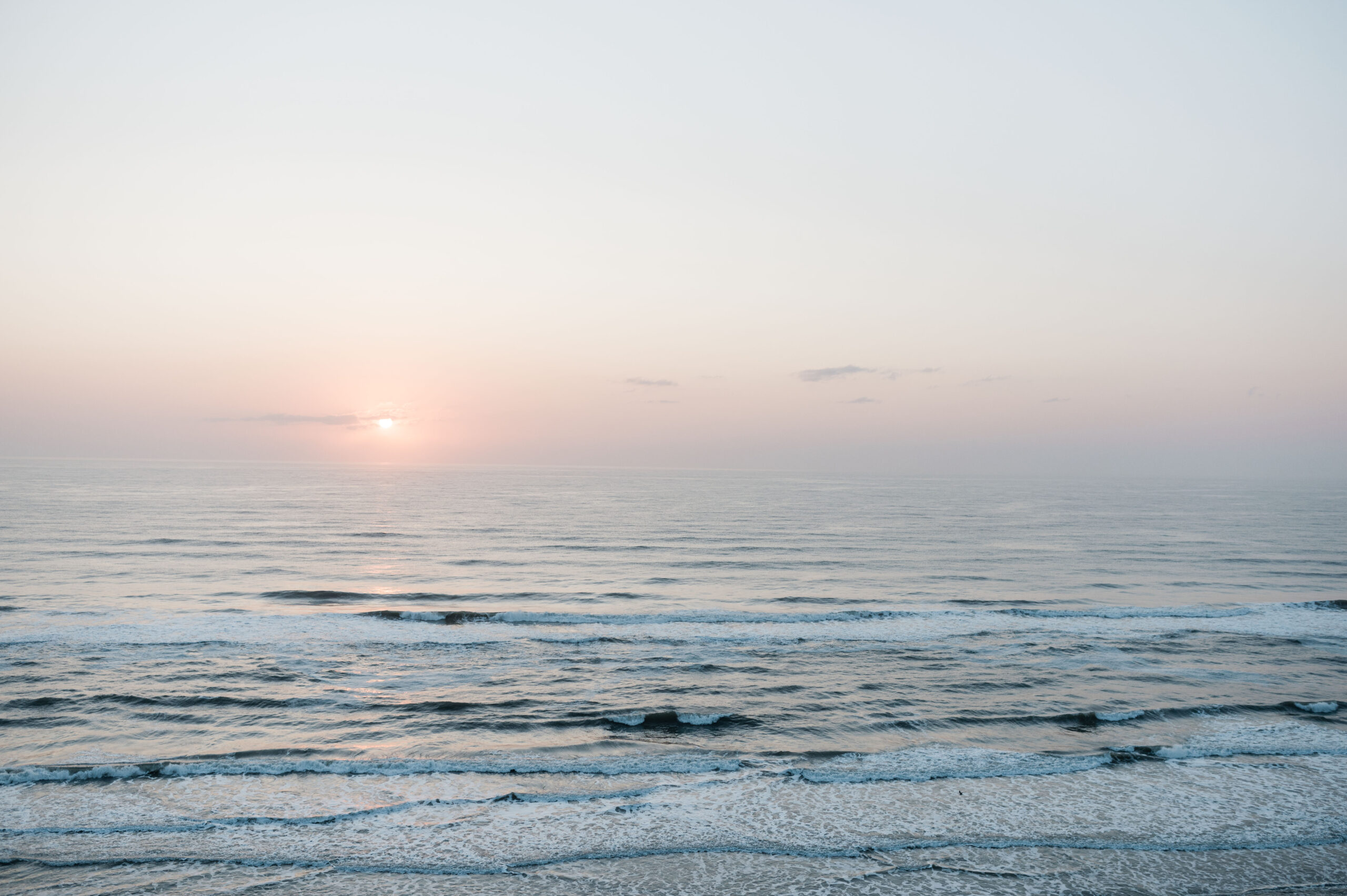 Beautiful sunrise with hues of orange blue purple from the balcony of Max Daytona Beach Resort