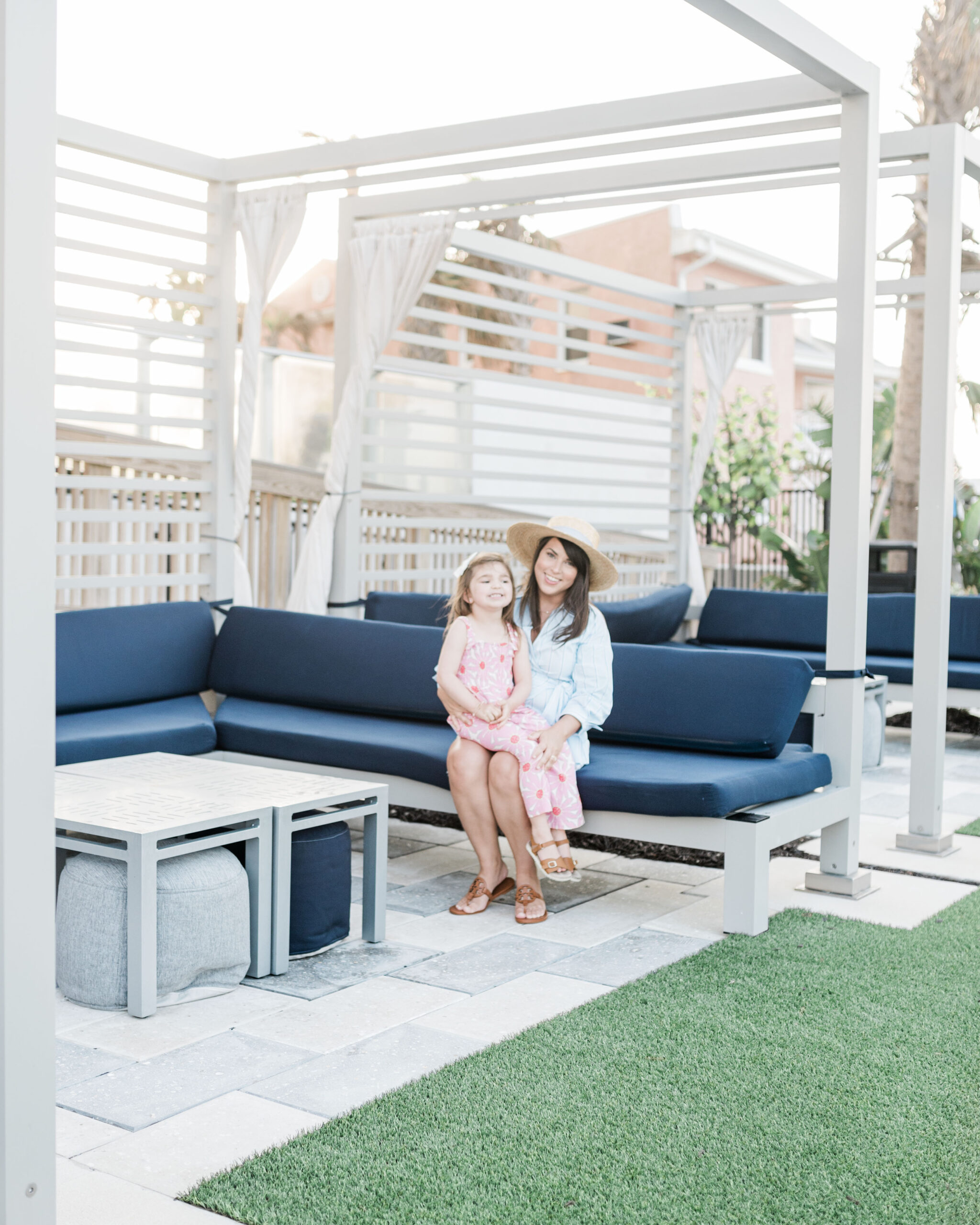 Brittney Naylor and daughter Eleanor sitting in Cabana area at Max Daytona Beach Resort