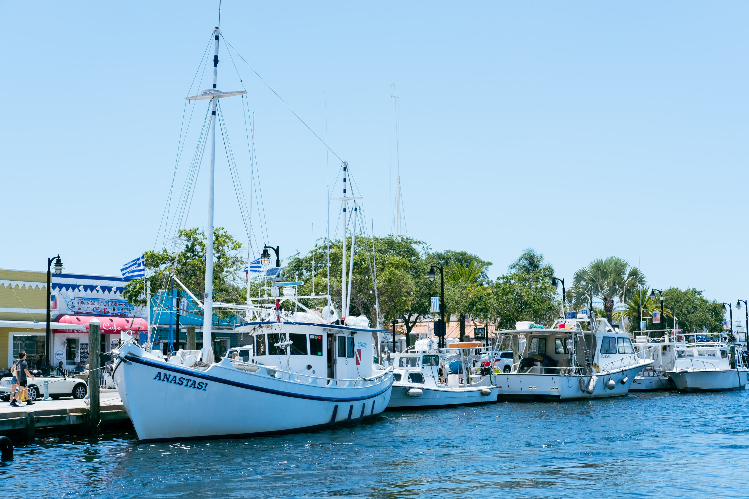 Several boats sitting in the water of Tarpon Springs. Photo by Next Stop Adventures. Best Day Trips from Orlando