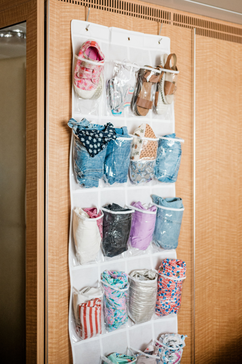 Example of using shoe organizer for kid's clothes on cruise ship--amazon cruise ship essentials for families. Stress-free cruising with kids.