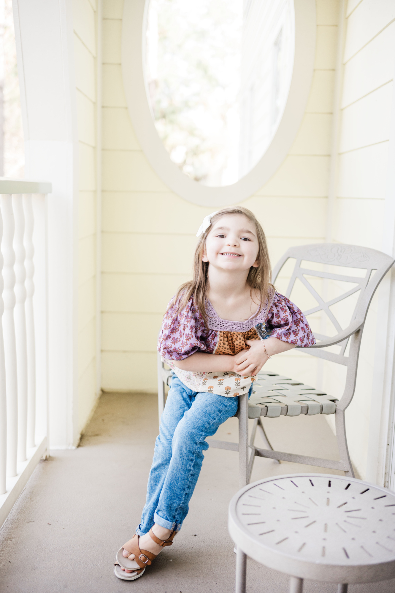 Eleanor sitting in chair on the balcony of one bedroom villa at Disney's Saratoga Springs resort