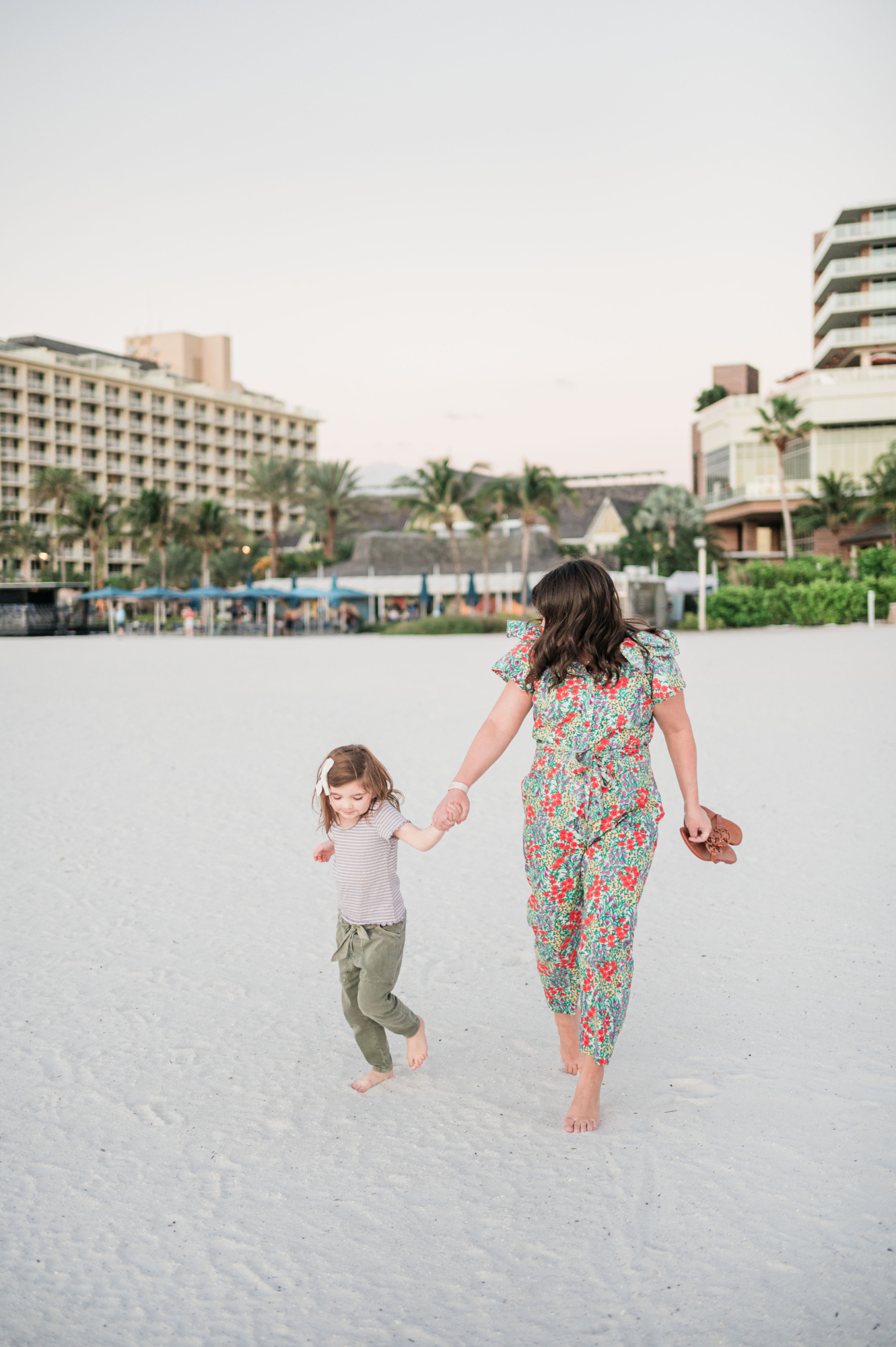 Brittney and Eleanor running in the sand at JW Marriott Marco Island--best resort in Marco Island