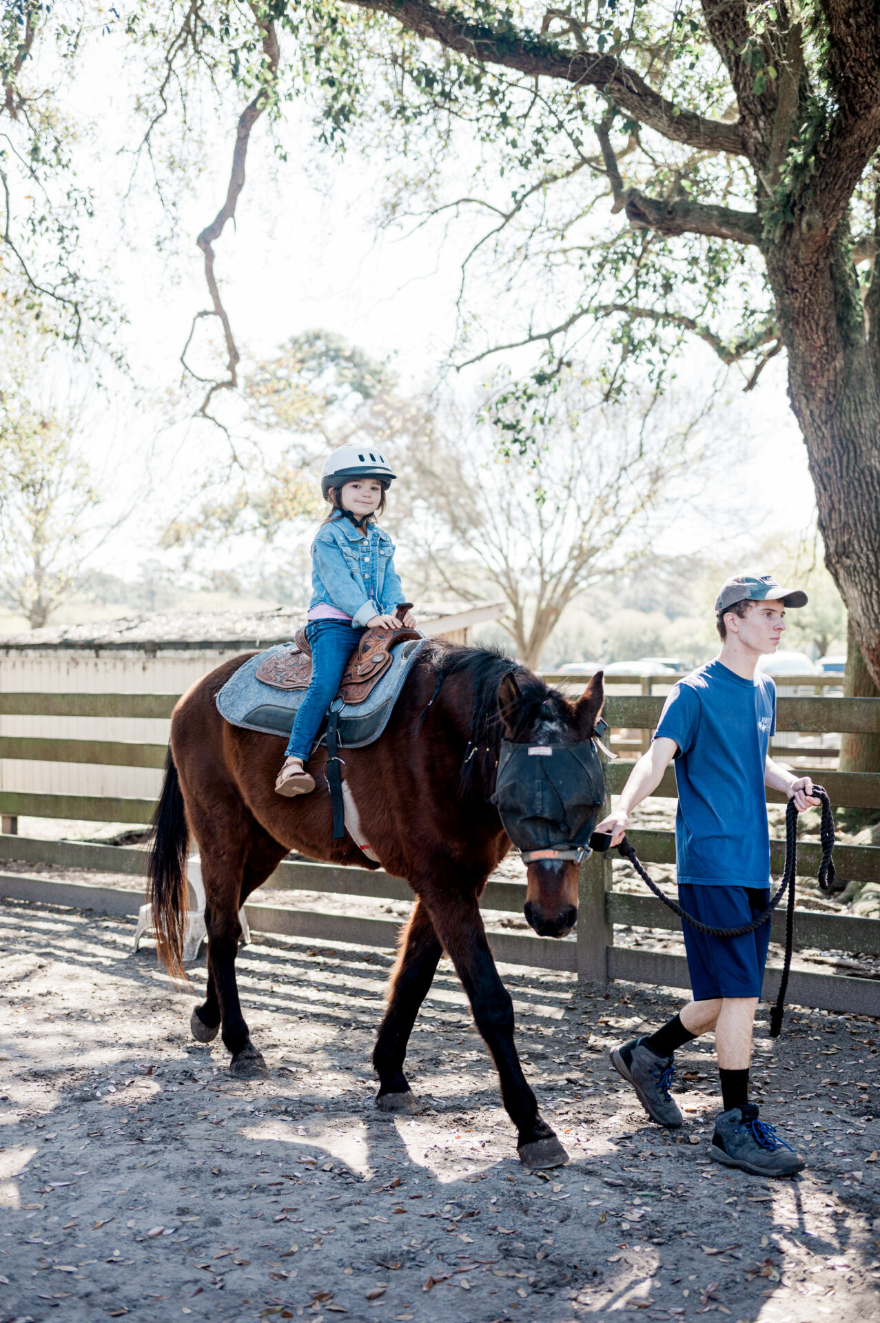 Eleanor riding a brown horse at Lawton Stables in Sea Pines Resort in Hilton Head Island--family friendly activities in hilton head island
