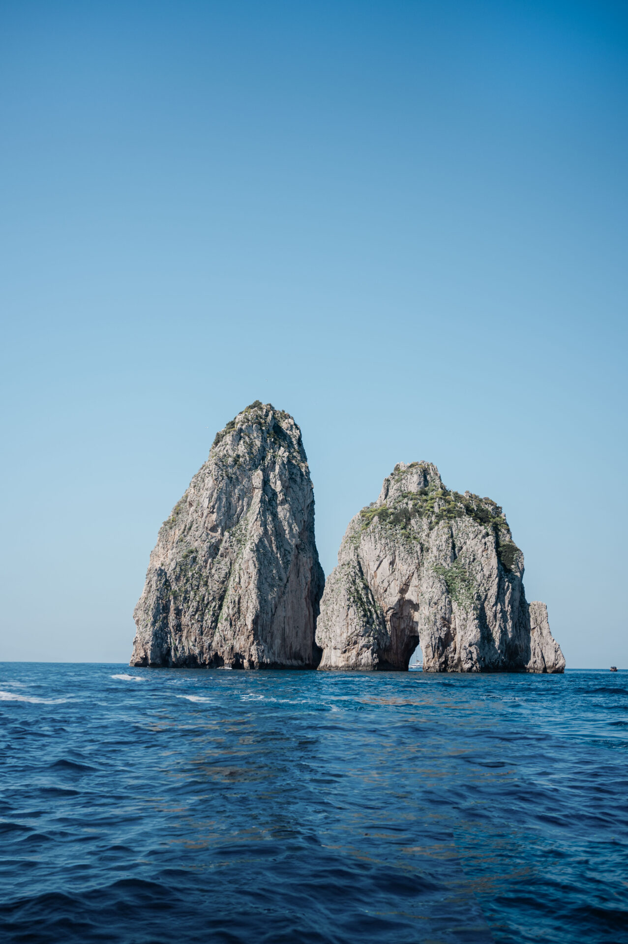 Faraglioni rocks in Capri as seen from a boat on private boat tour of Capri--3 days in Positano