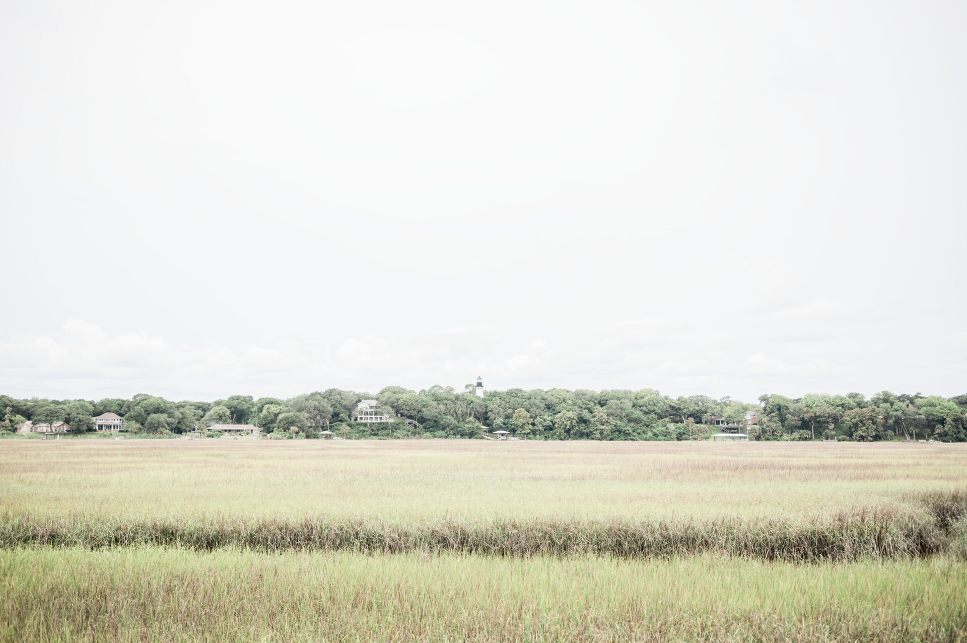 Amelia Island Lighthouse in the distance past the marsh wetlands 